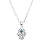 RvKklER1 hamsa hand necklace white gold s1 clear and blue v1.jpg 1